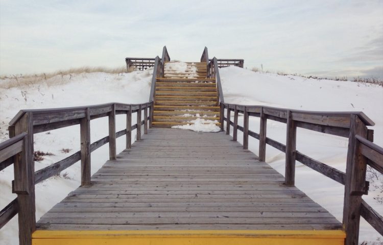 walkway to snow filled beach