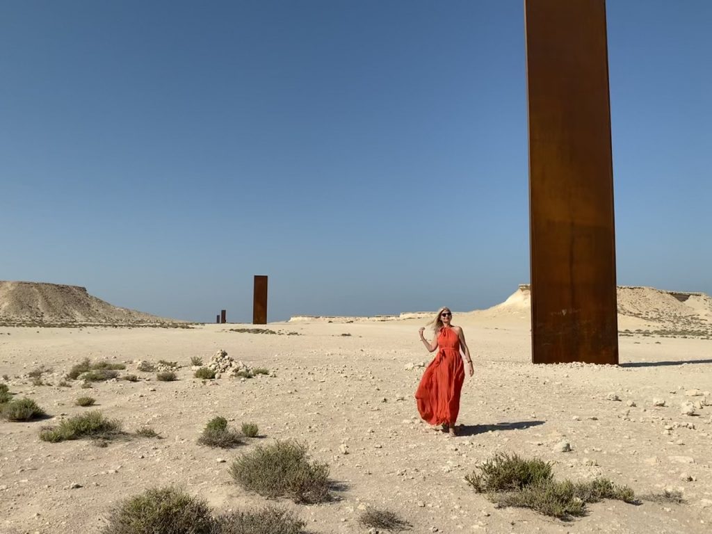 Tijana in Qatar Doha in the midst of East-West/West-East Sculptures by Richard Serra  in Qatari Desert. Kalita dress. 