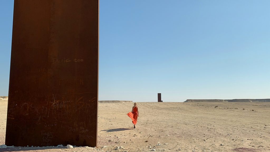 Tijana walking in Qatar desert.

Kalita dress.