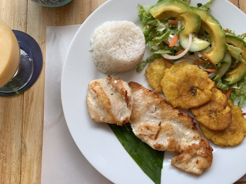 Traditional Colombian chicken rice dish and lulo juice