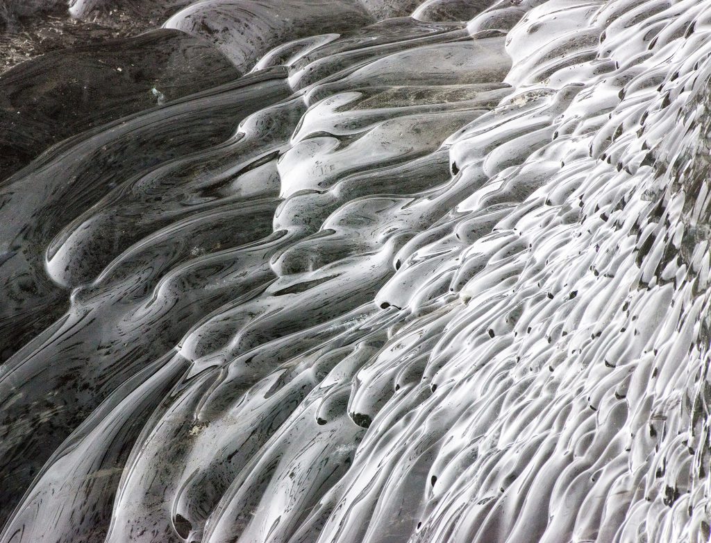 Detail of volcanic black ice caves in Iceland