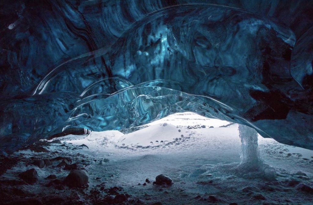 The thick blue ice of the ice caves in Iceland