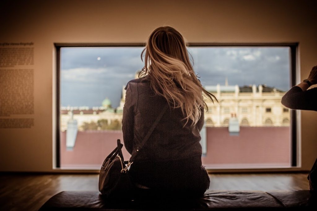 Tijana looking through a window