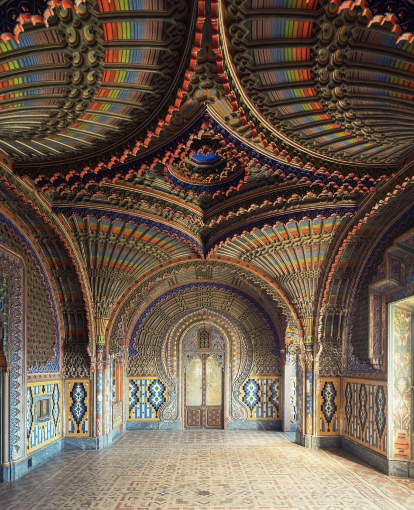 La Sala dei Pavoni by N. Bertellotti. An exquisite abandoned room with rainbow colored walls filled with ornate accents and details. 