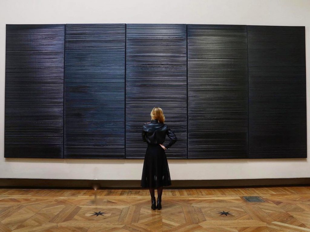 Woman admiring Pierre Soulages work