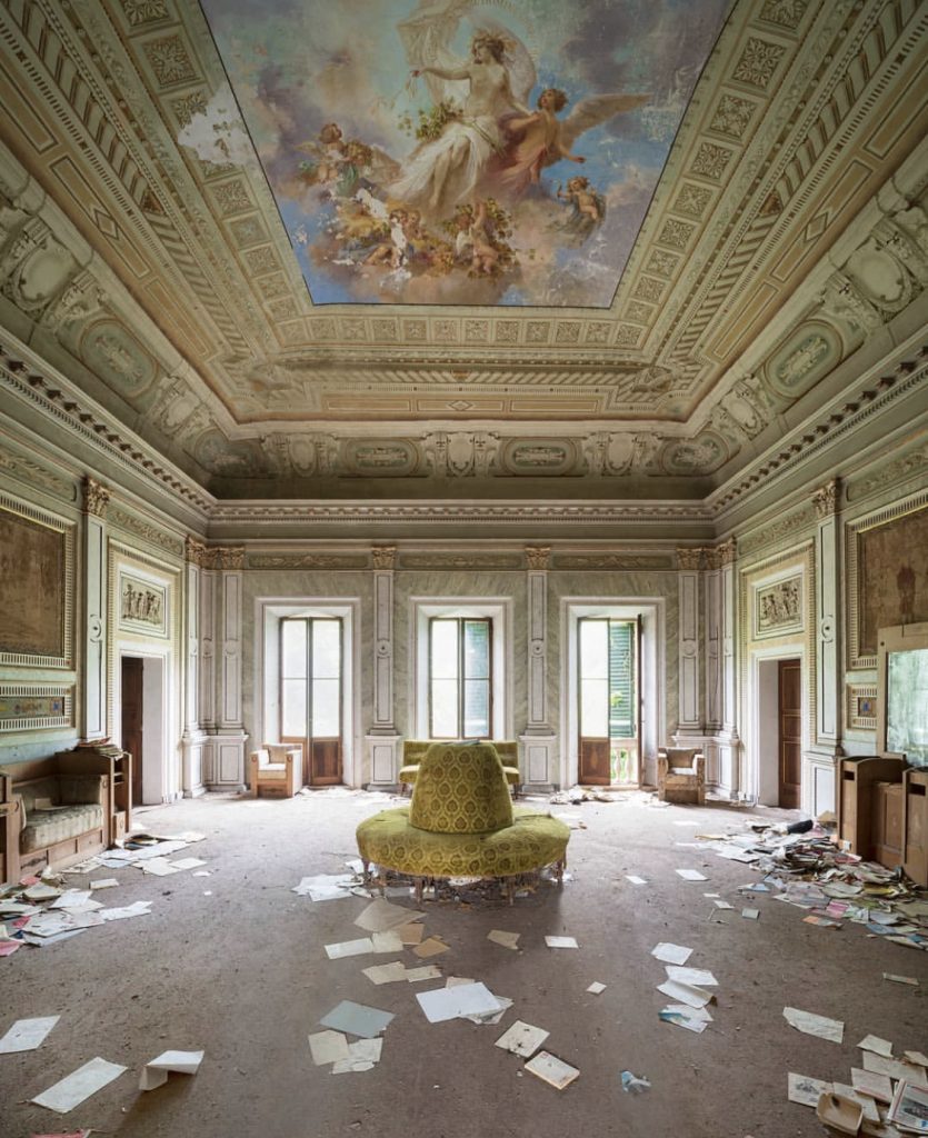 Il Demone della Frivolezza by Nicola Bertellotti. An abandoned sitting area with a gorgeous detailed ceiling of angels. 