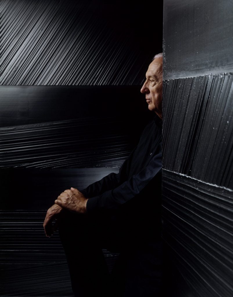 Pierre Soulage poses with his black paintings