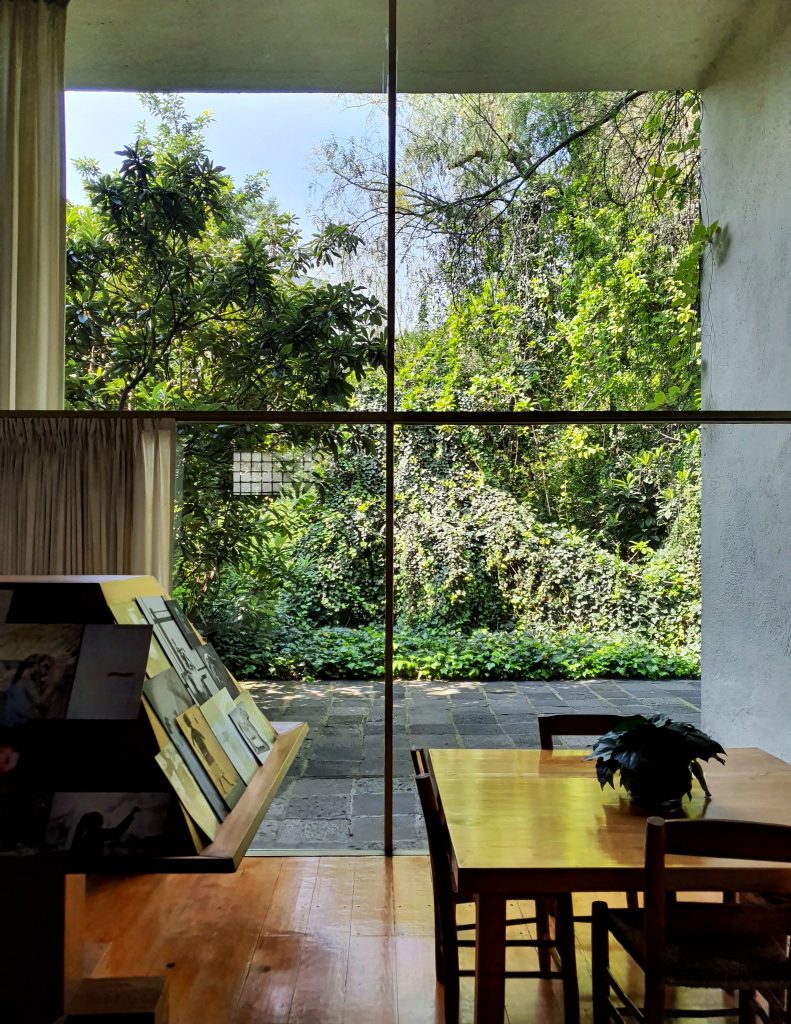 Looking through a enormous window into the garden. 