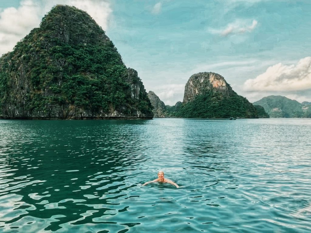 Swimming in the jade colored waters of Halong Bay.