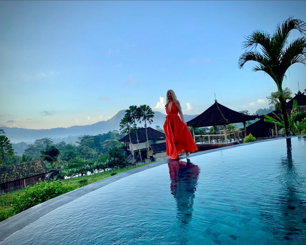 Tijana walking in a red dress in Bali