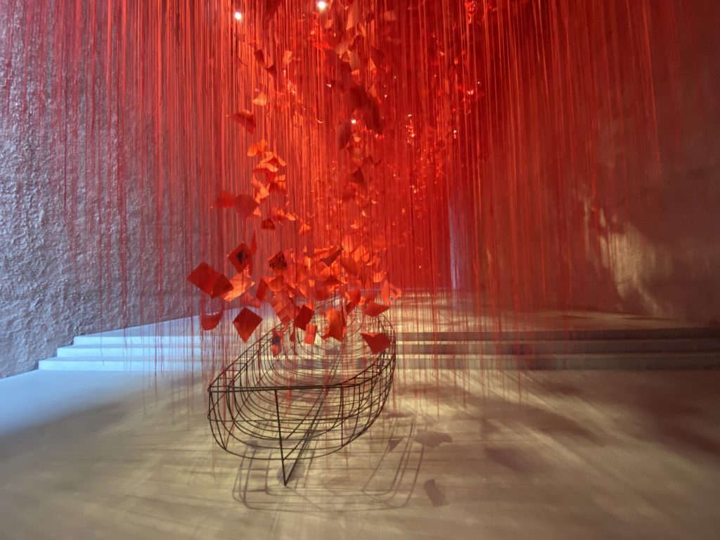 Boat and red threads at the "I hope" exhibition by Chiharu Shiota at the Koenig Galerie in Berlin.