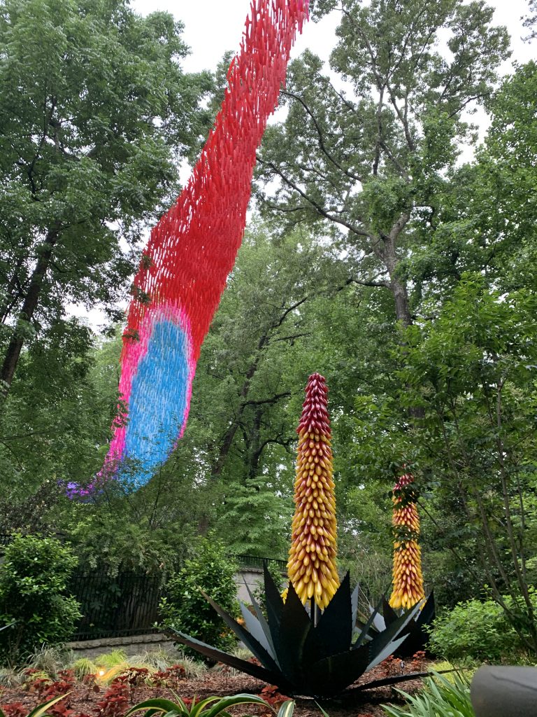 The aerial art compliments the organic nature of the flowers below.