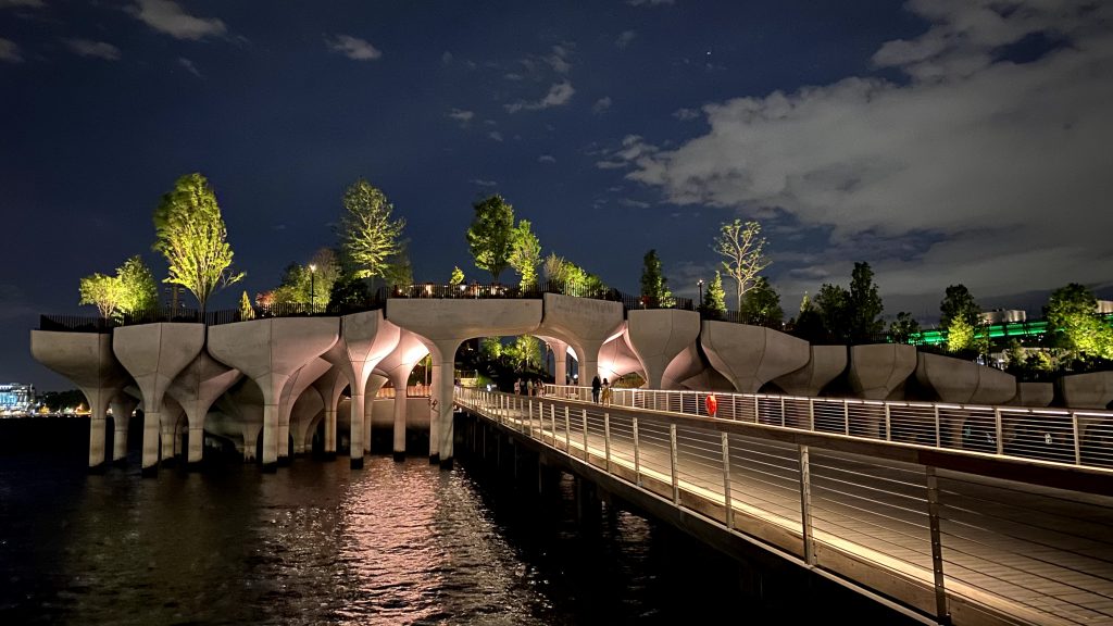 Little Island by Thomas Heatherwick lit up at night 